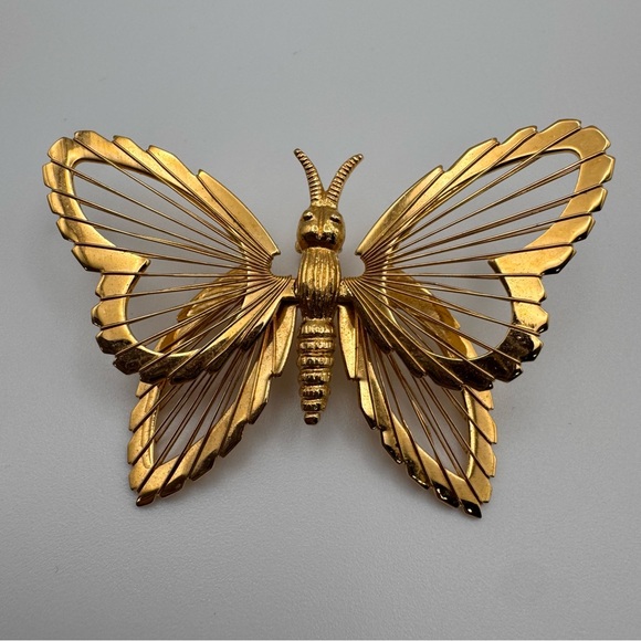 Monet gold-tone metal butterfly brooch filigree or "harp-like" wire wing design - Picture 2 of 5